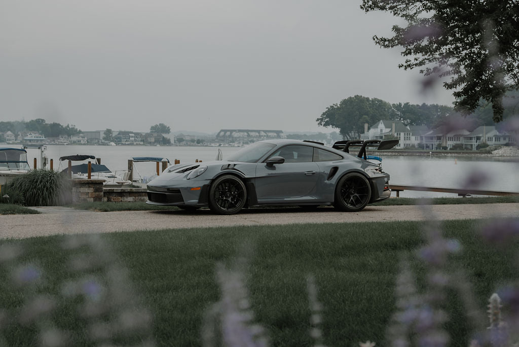Porsche parked by the water at the GLADIX lake shoot